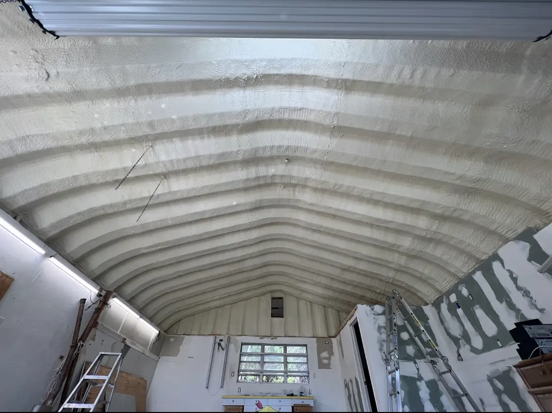 Spray polyurethane foam applied to the underside of a metal roof deck in Waianae